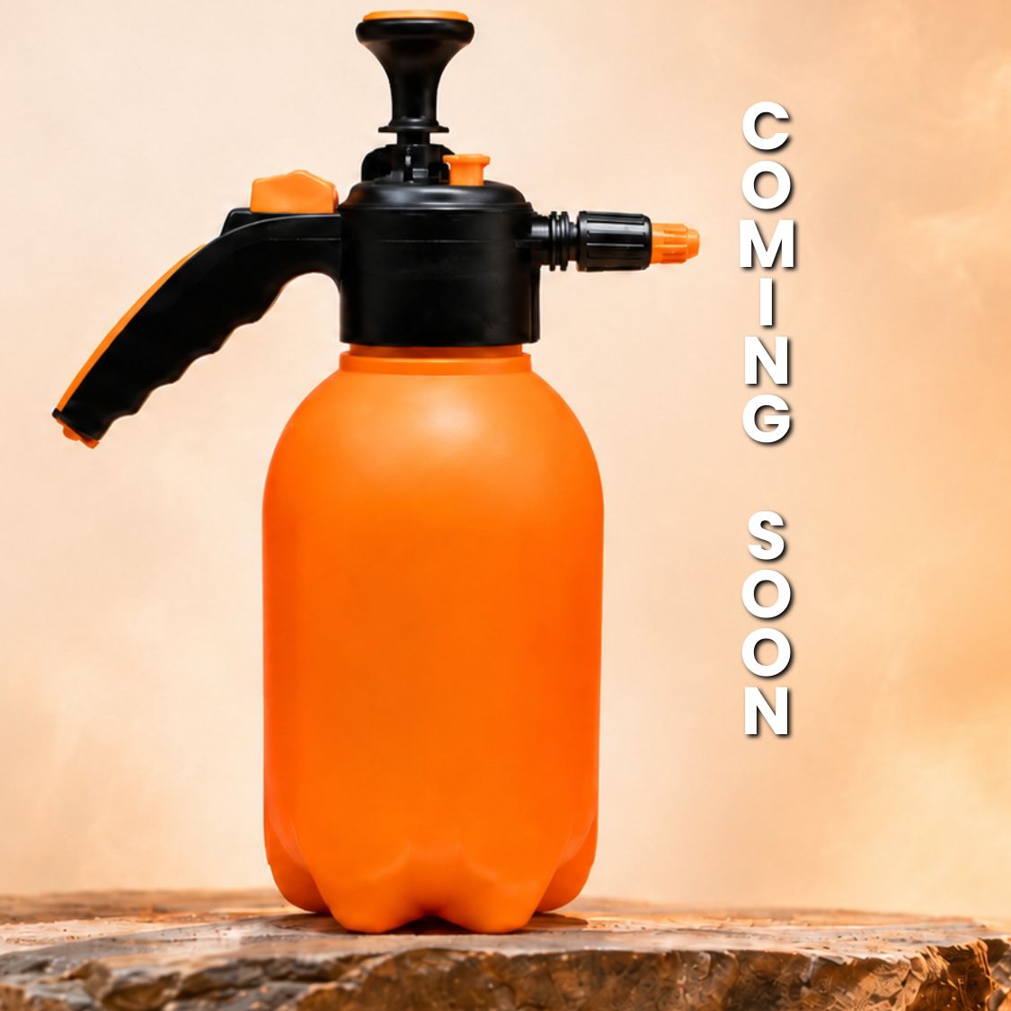 A Smokin and Grillin wit AB BBQ Spritz Bottle in orange and black rests on a wooden surface, with "COMING SOON" displayed vertically on the right against a neutral background.
