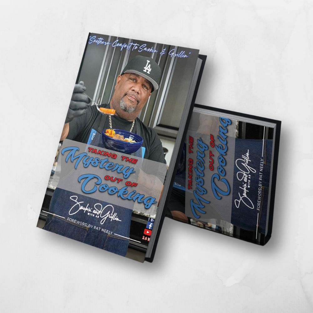 The Smokin and Grillin wit AB Taking the Mystery out of Cooking Cookbook features a man in a black chef coat and LA cap holding a spoon of sauce, offering delicious meals and stress-free cooking, with a foreword by Pat Neely.